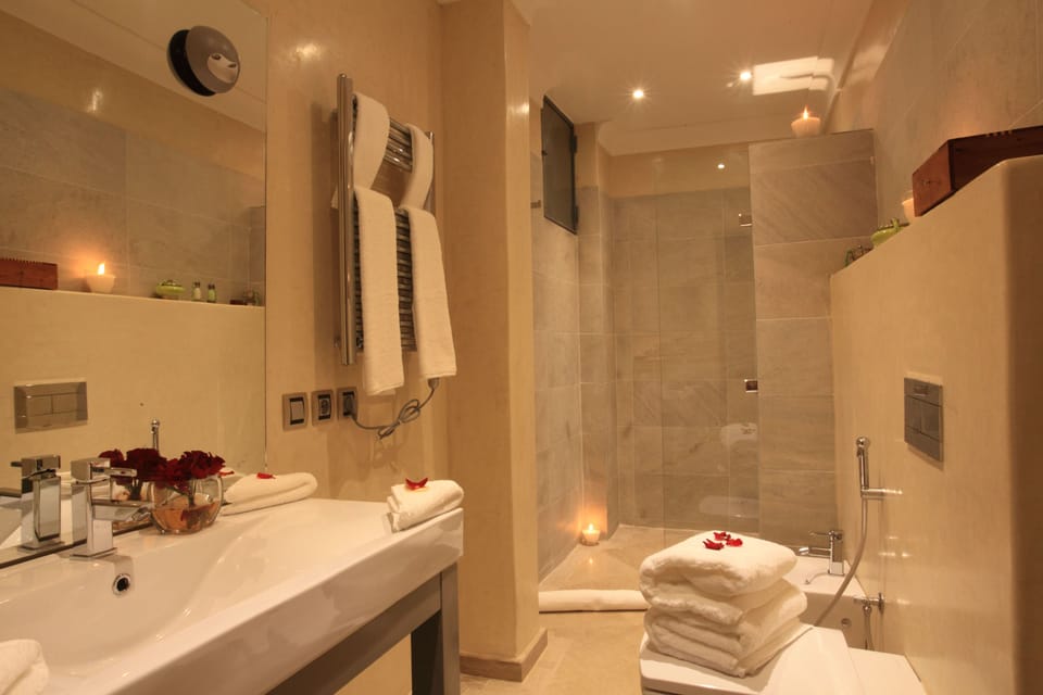 Shower, designer toiletries, hair dryer, bidet