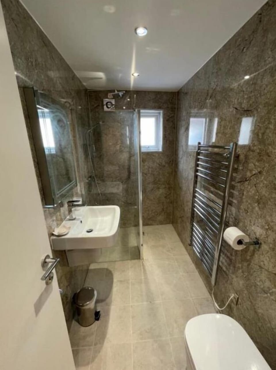 Shower, rainfall showerhead, hair dryer, towels