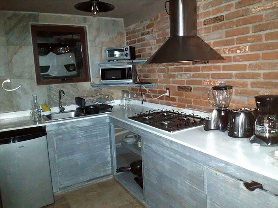 Coffee/tea maker, mini-fridge, microwave, stovetop
