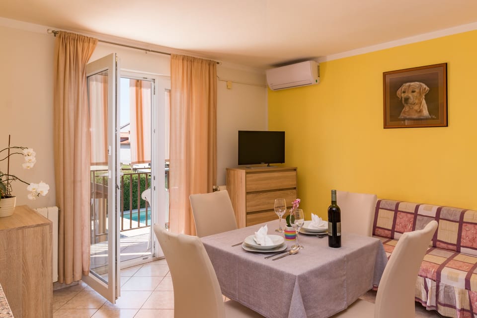 Classic Apartment | Living area | 60-inch flat-screen TV with cable channels