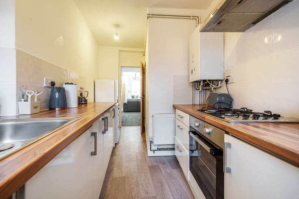 Executive Apartment, 2 Bedrooms | Private kitchen | Cleaning supplies, paper towels, dining tables