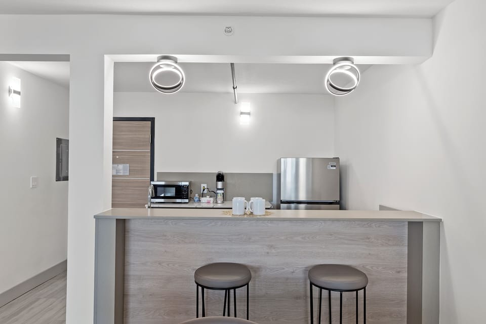 Suite, 1 King Bed with Sofa bed, Balcony | Private kitchen | Highchair