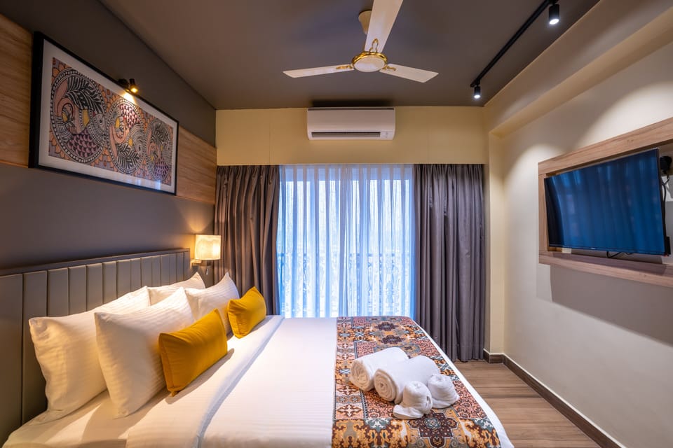 Deluxe Double Room, Balcony, Partial Sea View | In-room safe, laptop workspace, iron/ironing board (on request)