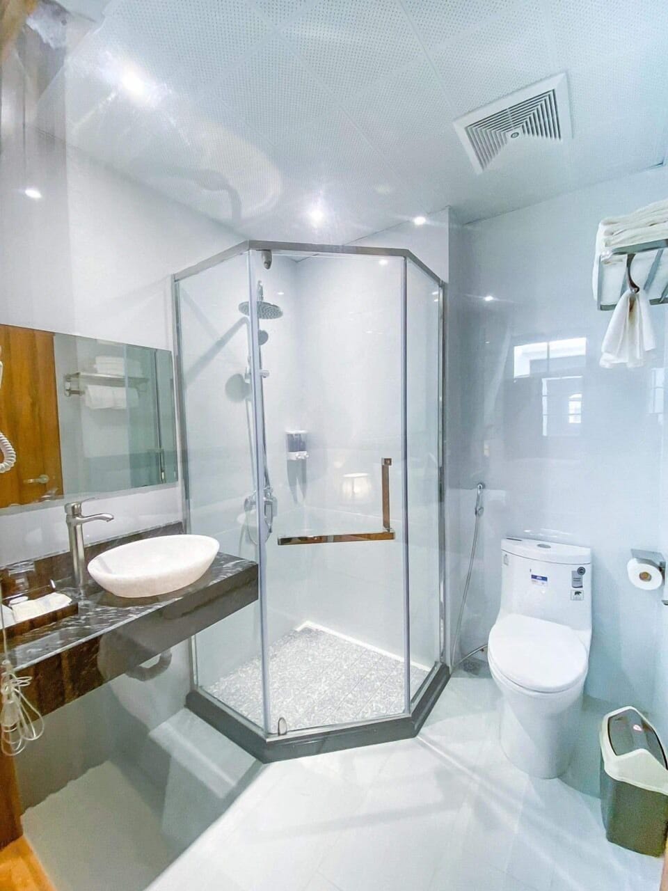 Shower, rainfall showerhead, designer toiletries, hair dryer
