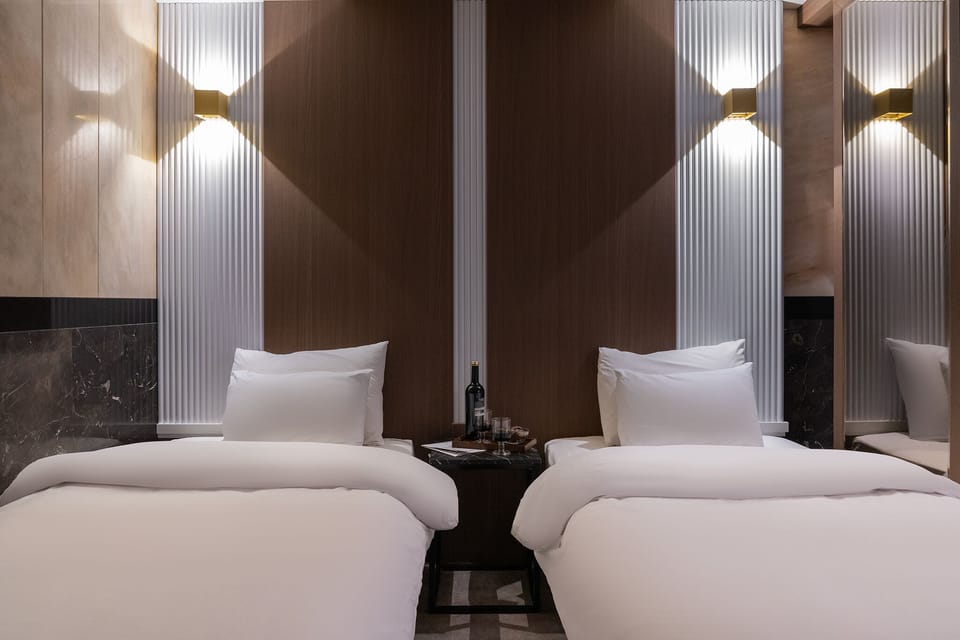Signature Deluxe Twin | Premium bedding, down comforters, individually decorated