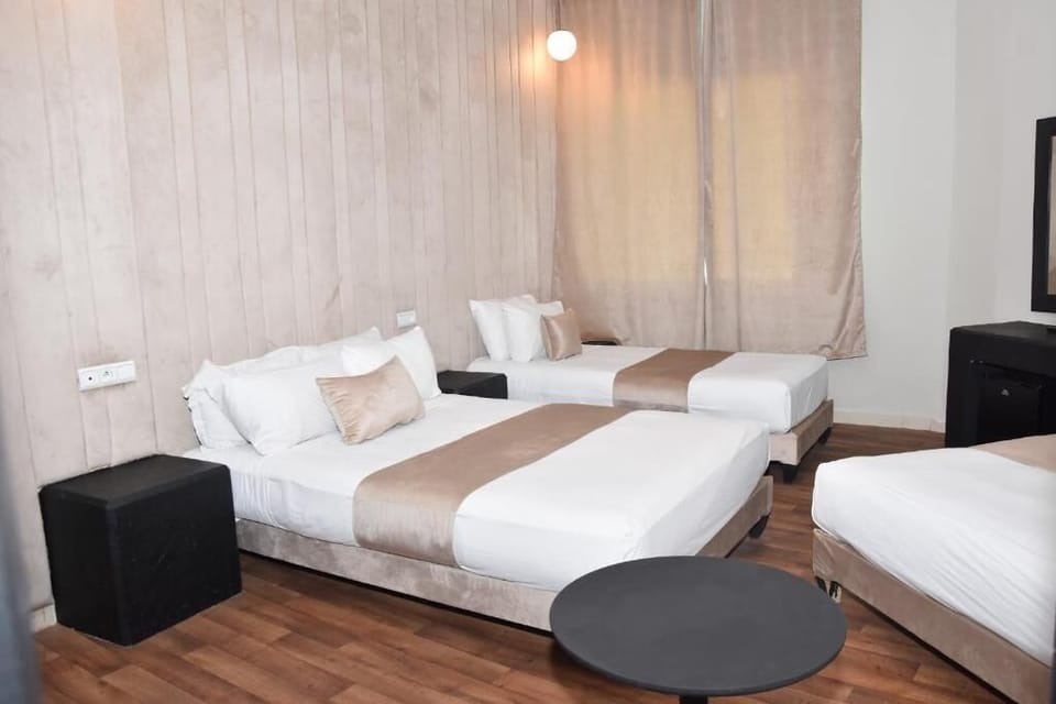 Classic Quadruple Room | In-room safe, desk, laptop workspace, soundproofing