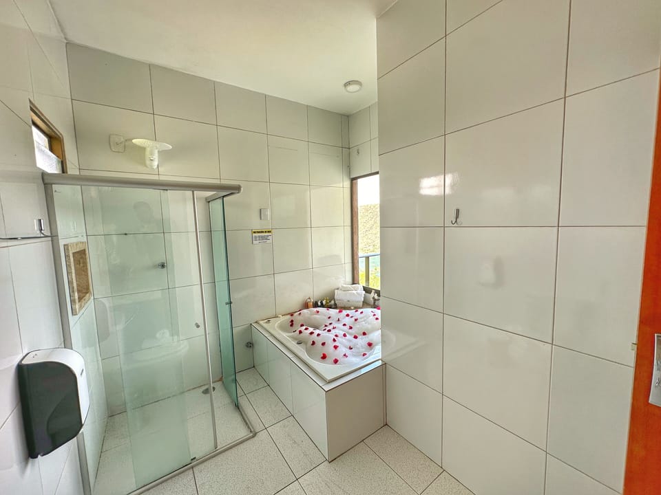 Deluxe Double Room | Bathroom | Hair dryer, towels, soap, shampoo