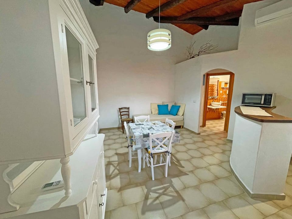 Comfort Apartment | Living area | 32-inch flat-screen TV with cable channels