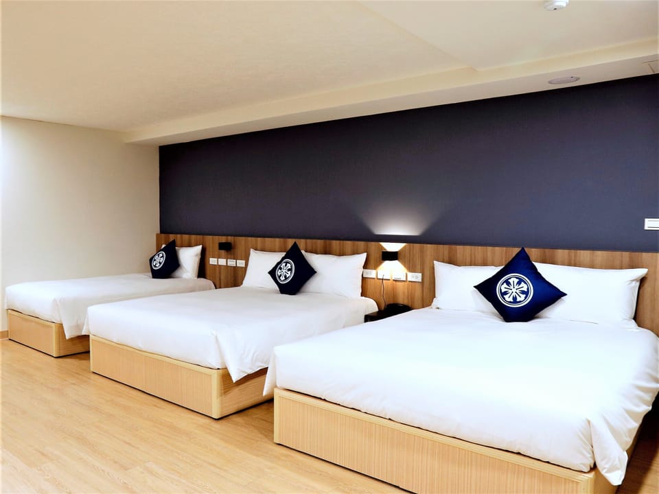 Family Room | Premium bedding, down comforters, desk, blackout drapes