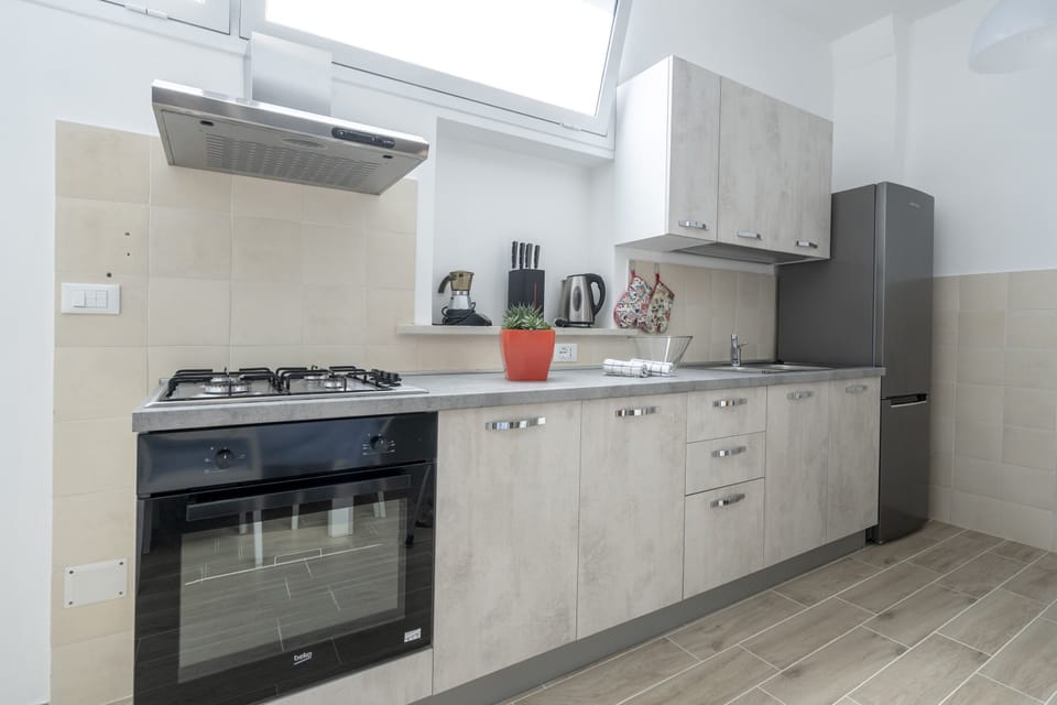Comfort Apartment | Private kitchen | Full-size fridge, oven, stovetop, electric kettle