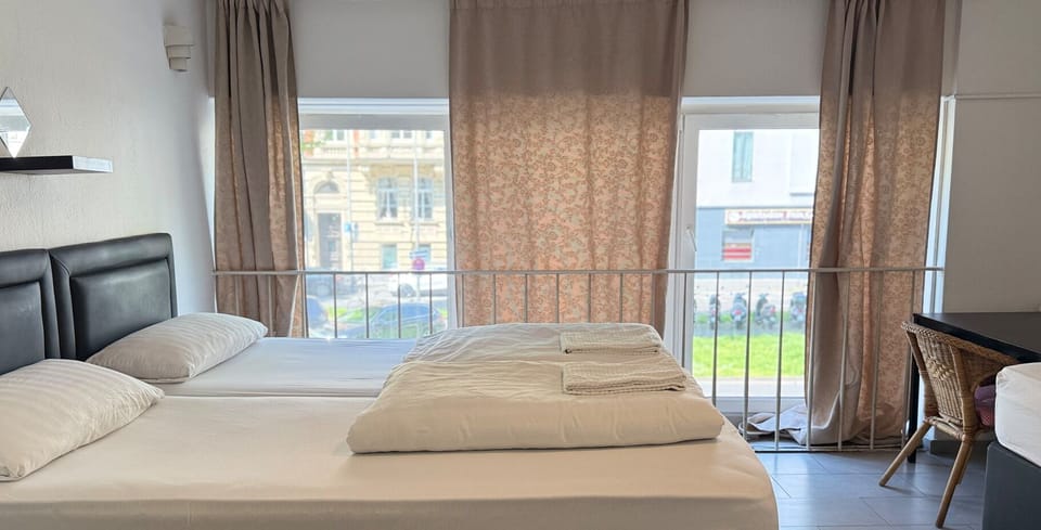 Deluxe Triple Room, Private Bathroom | Desk, iron/ironing board, free WiFi, bed sheets
