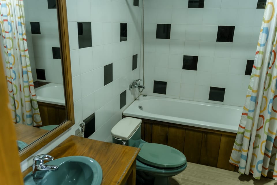 Deluxe Studio Suite | Bathroom | Separate tub and shower, rainfall showerhead, hair dryer, bathrobes