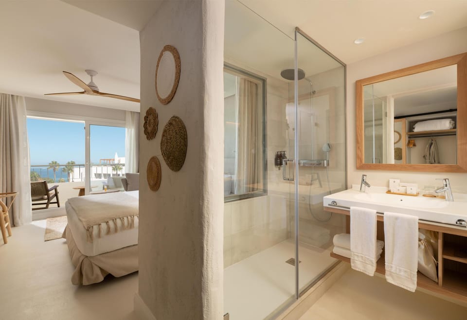 Double or Twin Room, Partial Sea View | Bathroom | Shower, hair dryer, bathrobes, slippers