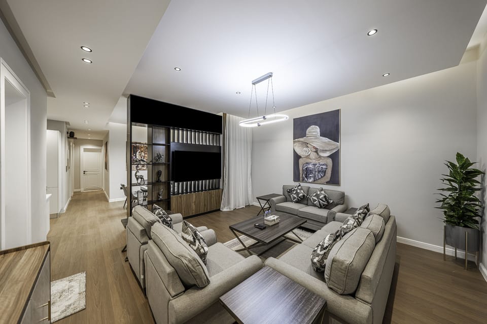Apartment, 3 Bedrooms | Living area | 65-inch LCD TV with digital channels
