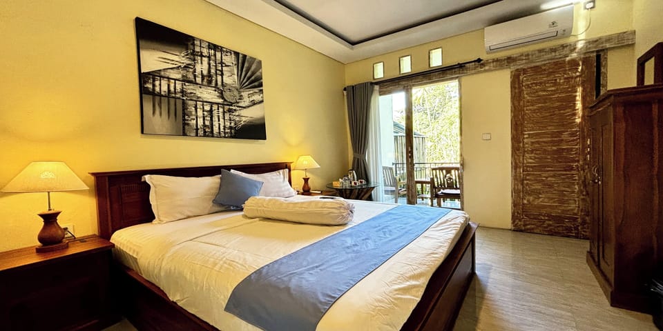 Deluxe Room Balcony with Jungle View | Desk, blackout drapes, free WiFi