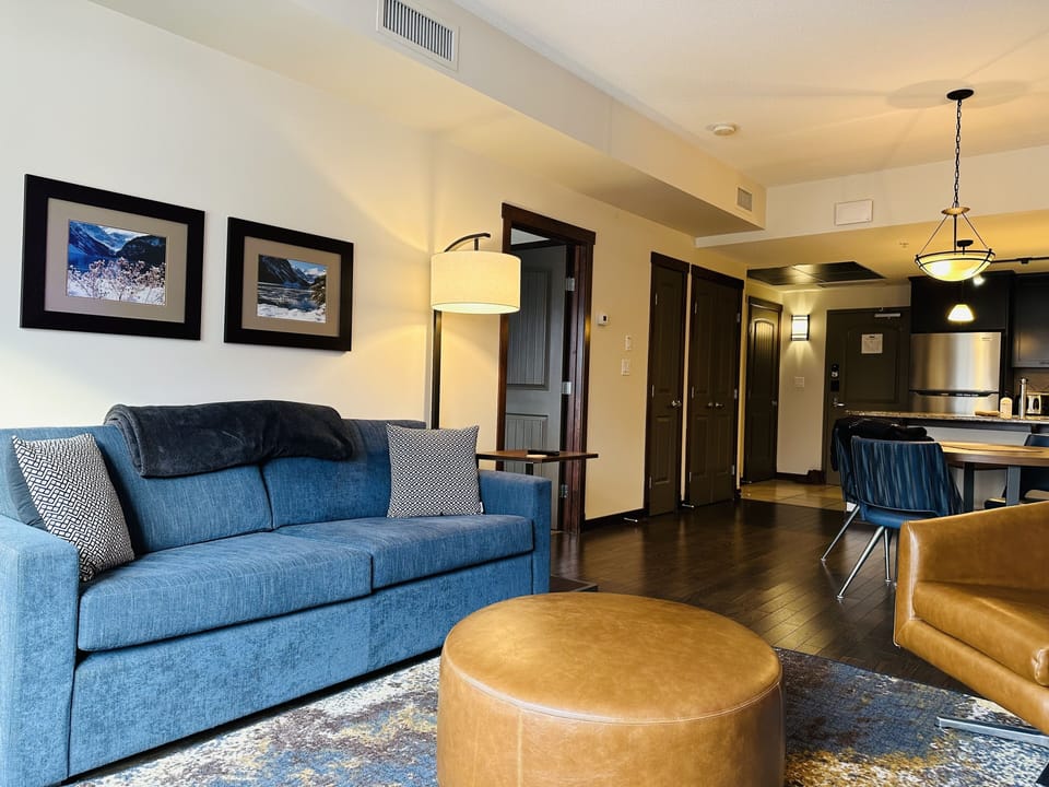 Family Suite | Living area | 50-inch Smart TV with cable channels, fireplace