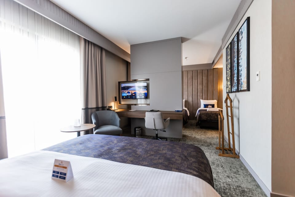 Family Quadruple Room | Premium bedding, minibar, in-room safe, desk
