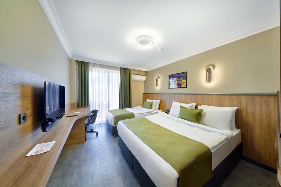 Superior Triple Room | In-room safe, desk, laptop workspace, blackout drapes