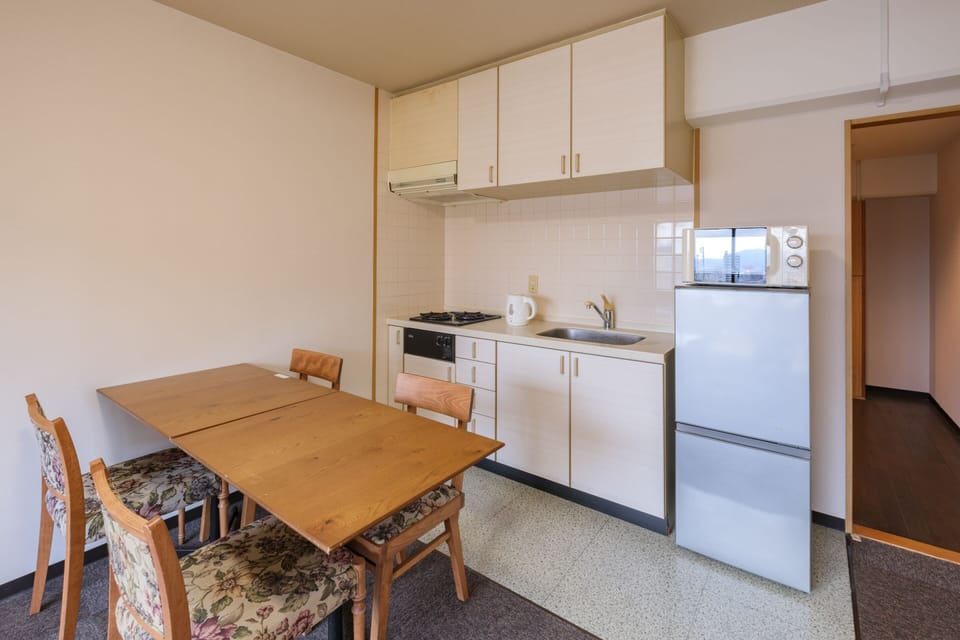 Junior Suite Room (2 Small Double Beds) with Kitchen - Non-Smoking - Cleaning Fee Extra | Private kitchen | Mini-fridge