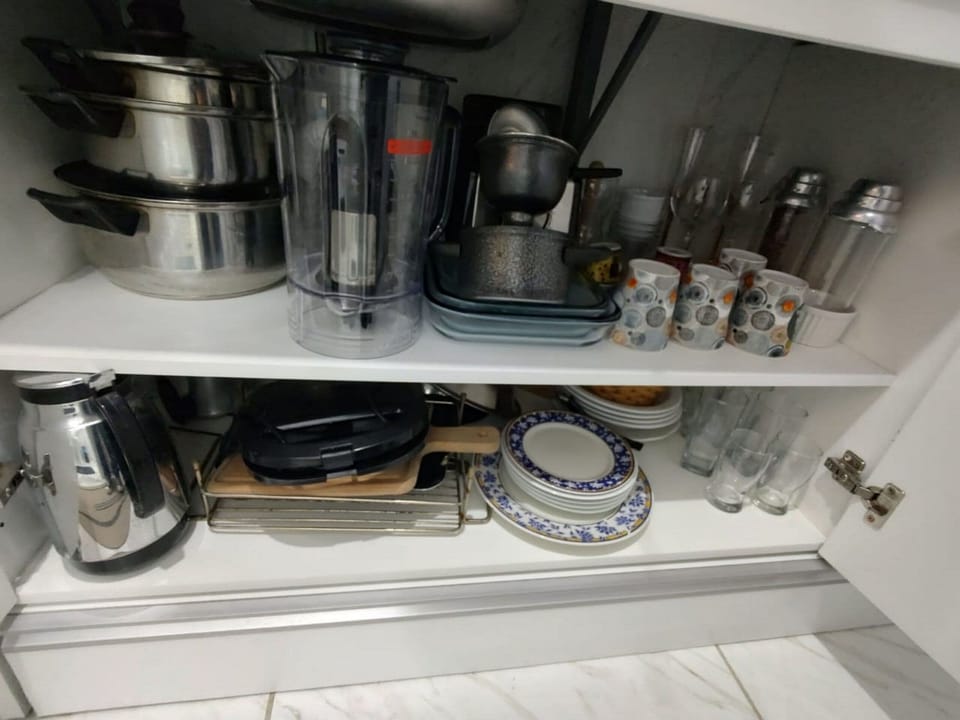 Basic Suite | Private kitchen | Microwave, coffee/tea maker, cookware/dishes/utensils, dining tables