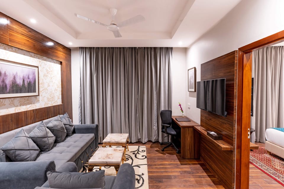 Suite with Balcony | Living area | 43-inch Smart TV with digital channels, streaming services