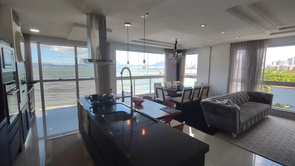 Deluxe Apartment, Beach View | Living area | 45-inch Smart TV with digital channels, Netflix, pay movies