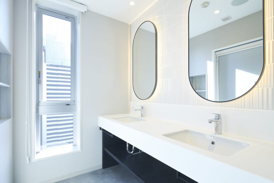Shower, hair dryer, slippers, towels