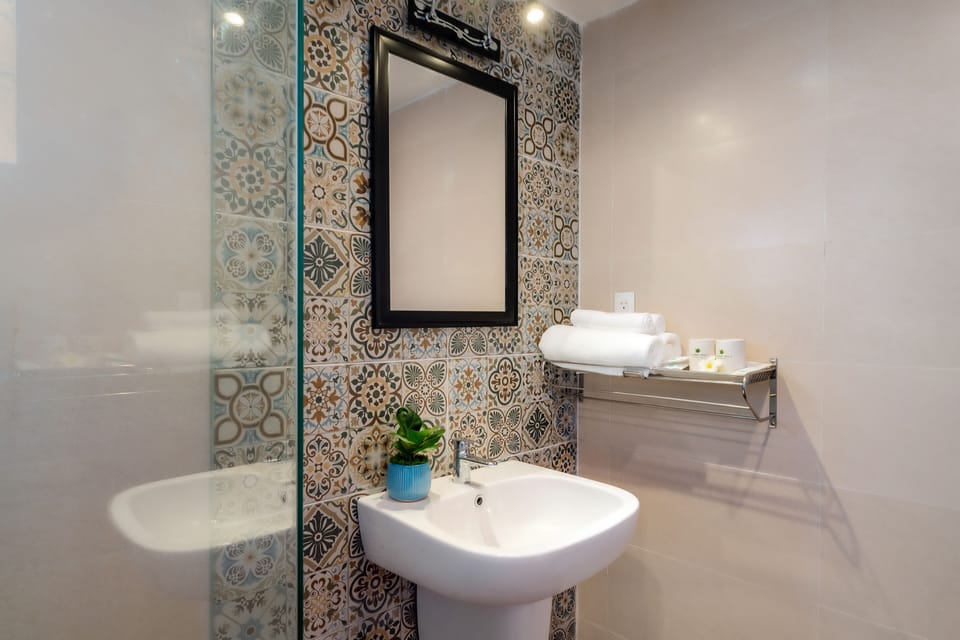 Shower, free toiletries, hair dryer, slippers