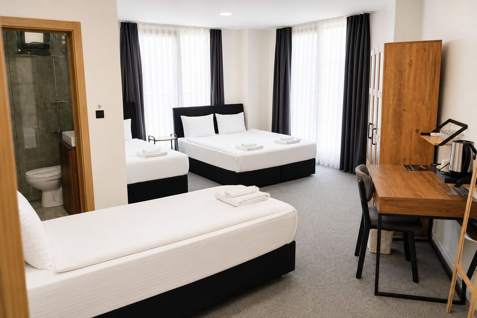 Deluxe Quadruple Room | Egyptian cotton sheets, premium bedding, minibar, desk