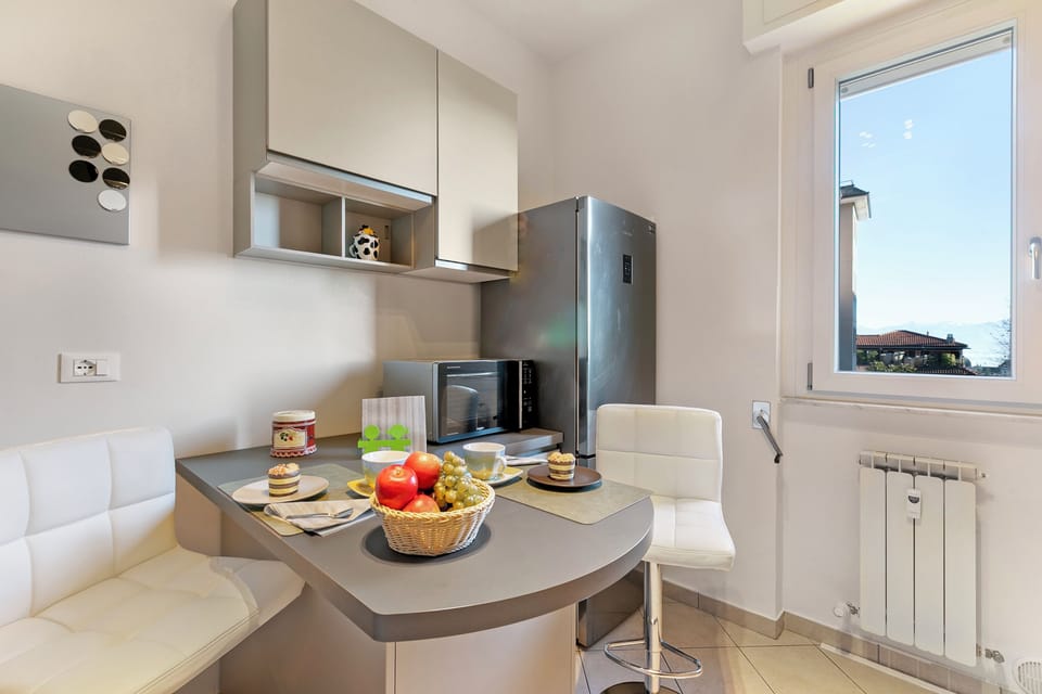 Family Apartment, Multiple Bedrooms (Alelù Classy And Chic Stresa Center) | Private kitchen | Fridge, microwave, oven, stovetop