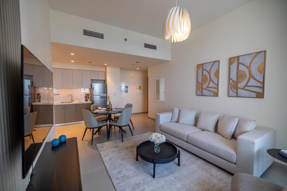 Deluxe Apartment | Living area | 55-inch Smart TV with cable channels