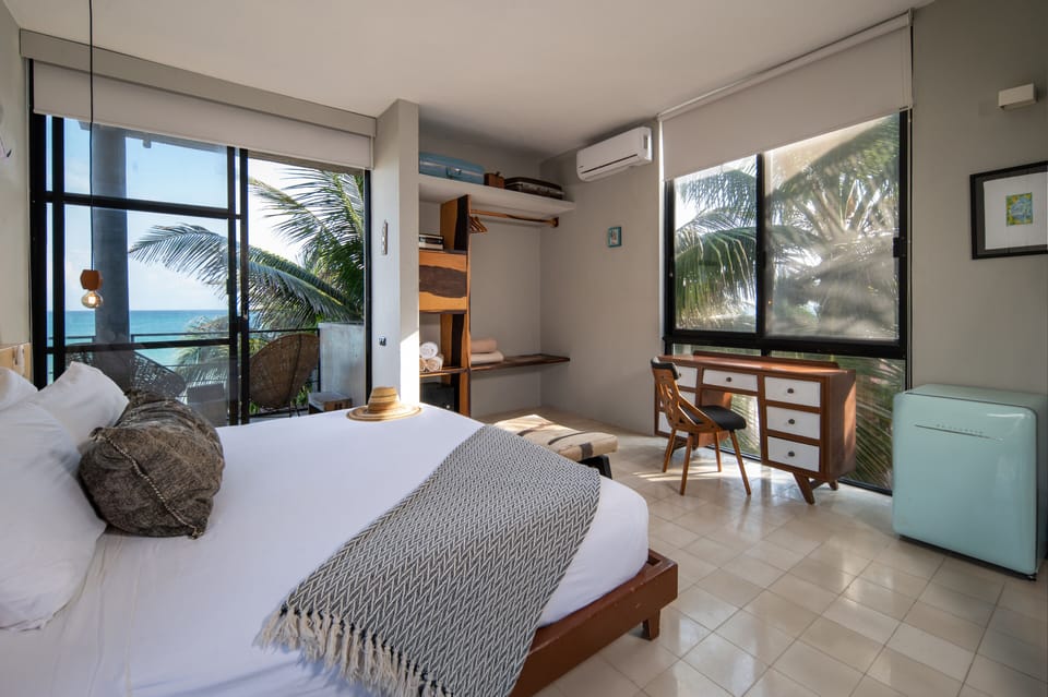 Suite, Sea View | Down comforters, in-room safe, individually decorated