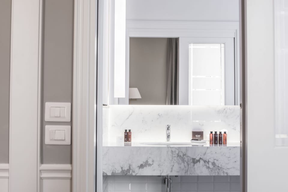 Shower, rainfall showerhead, designer toiletries, hair dryer