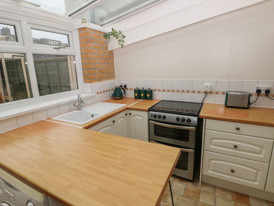 Fridge, electric kettle, toaster, cookware/dishes/utensils