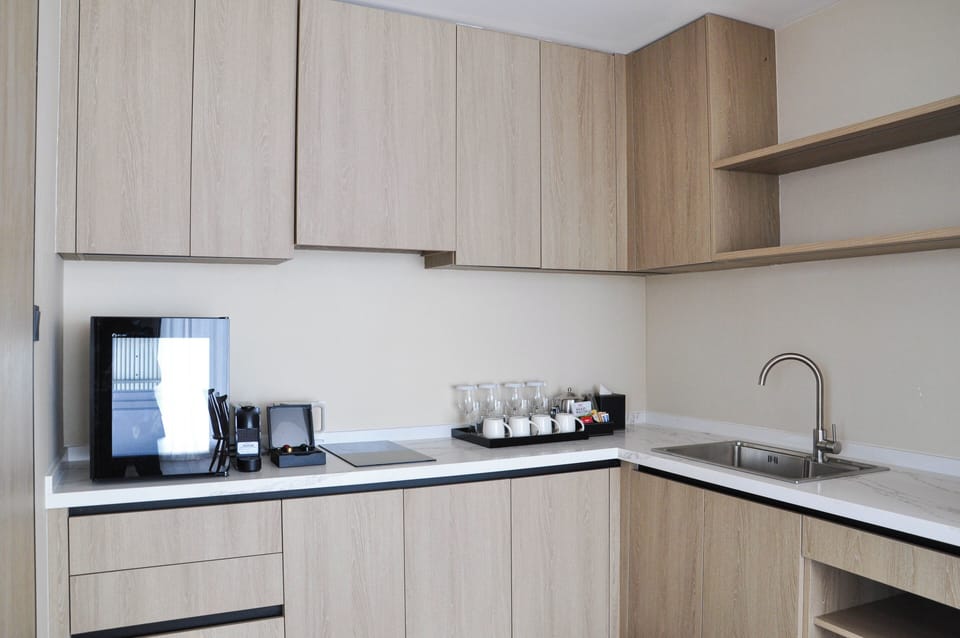 Two Bedroom Suite | Living area | 50-inch flat-screen TV with cable channels, toys