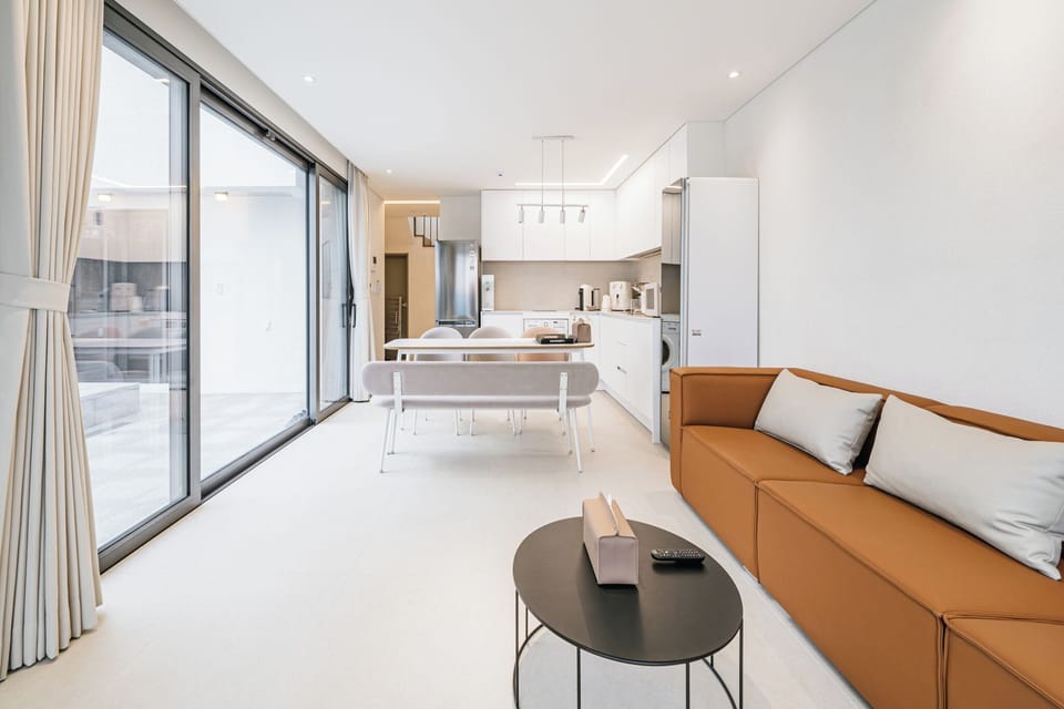 Deluxe Duplex, 2 Bedrooms, Private Pool, Ocean View | Living area | 50-inch LED TV with cable channels, Netflix, heated floors