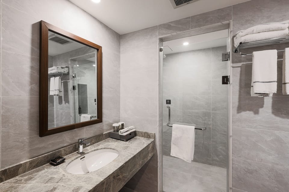 Rainfall showerhead, designer toiletries, hair dryer, bathrobes