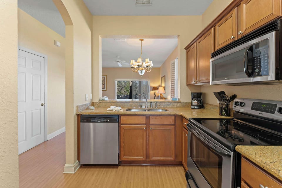Townhome, Multiple Beds, Patio, Garden View (Regal Palms Tropic Escape) | Private kitchen | Fridge, microwave, oven, stovetop