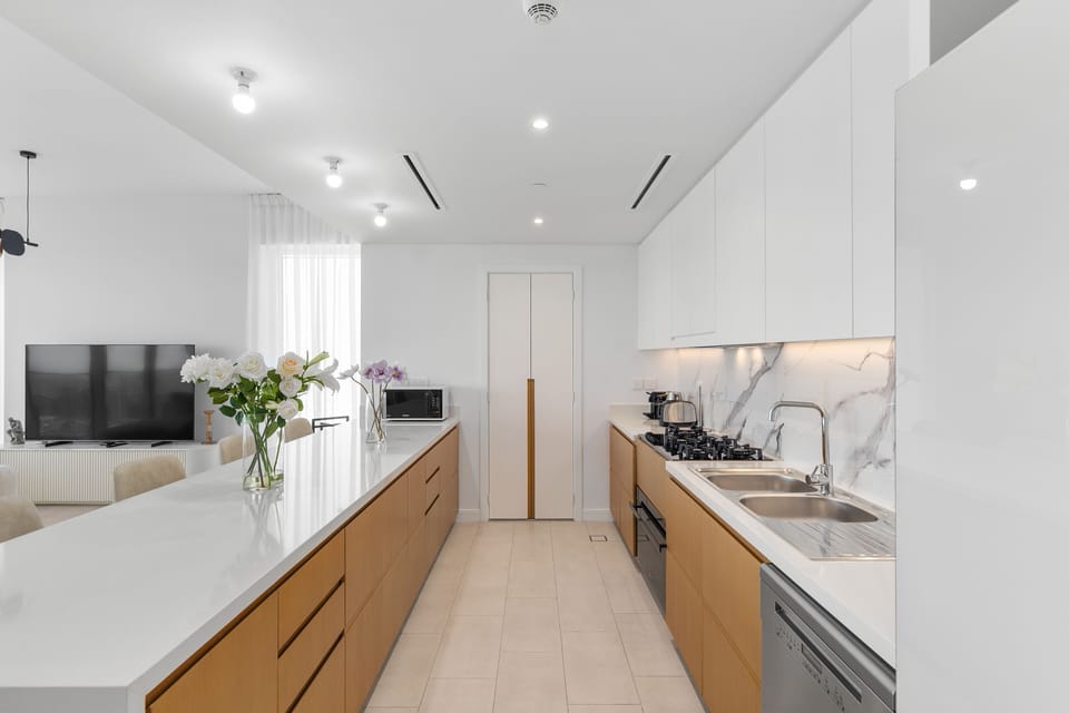 Deluxe Apartment, 4 Bedrooms | Private kitchen | Fridge, microwave, oven, dishwasher