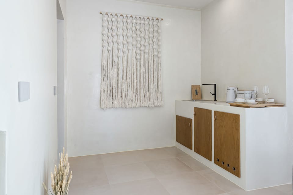 Luxury Suite, Partial Sea View | Private kitchen | Espresso maker, coffee/tea maker, electric kettle, dining tables