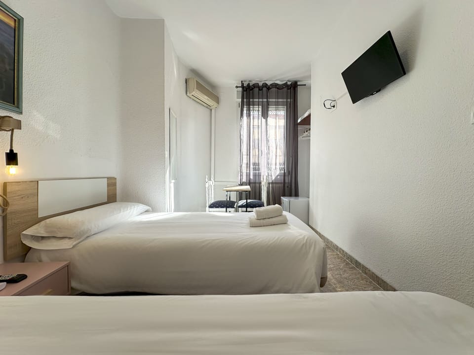 Twin Room, Shared Bathroom | Minibar, desk, iron/ironing board, free WiFi