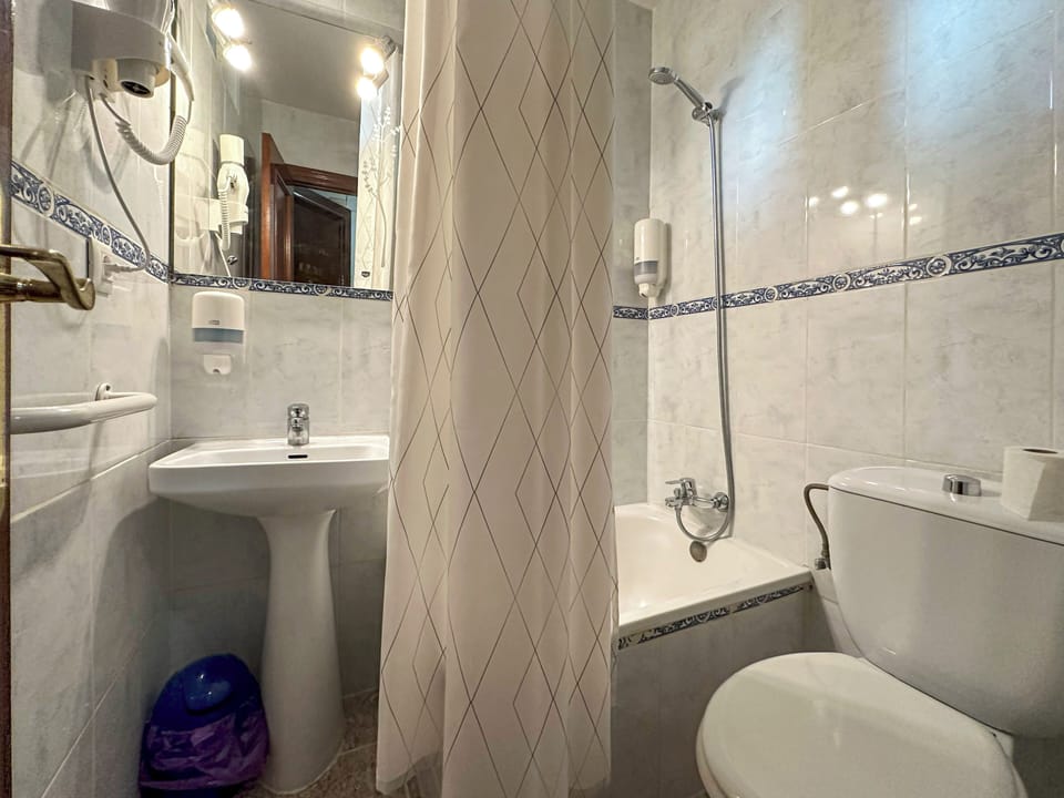 Hair dryer, towels, soap, shampoo