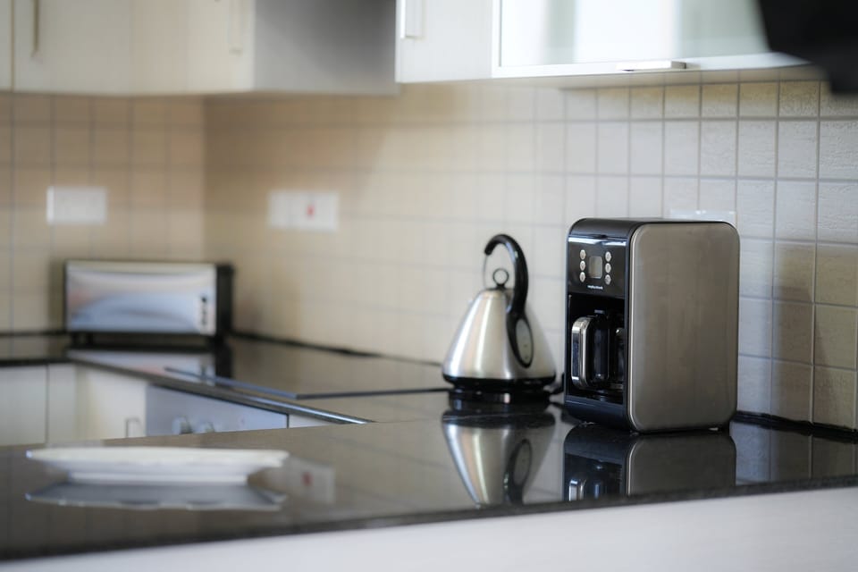 Comfort Apartment, 2 Bedrooms, Pool View | Private kitchen | Coffee/tea maker, full-size fridge, microwave, oven