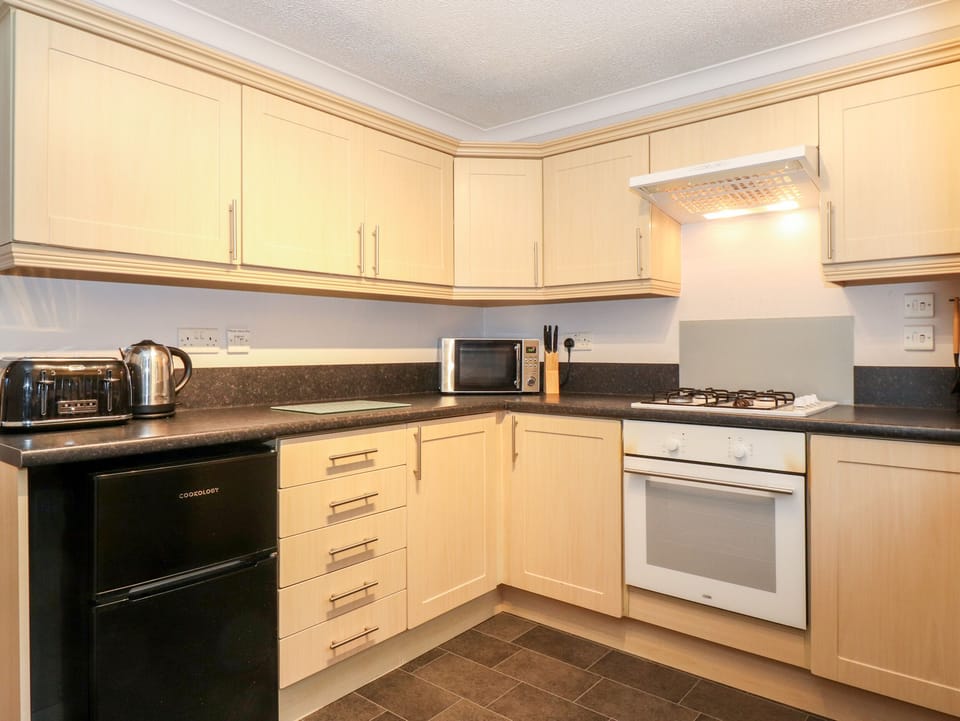 Fridge, electric kettle, toaster, cookware/dishes/utensils