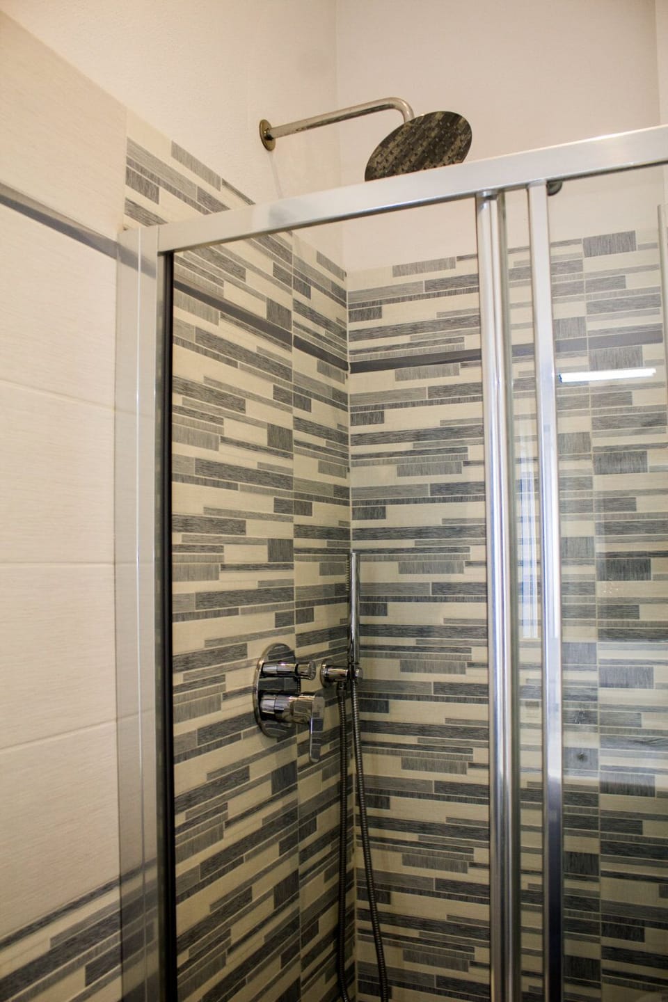 Quadruple Room | Bathroom | Shower, hair dryer, towels, soap