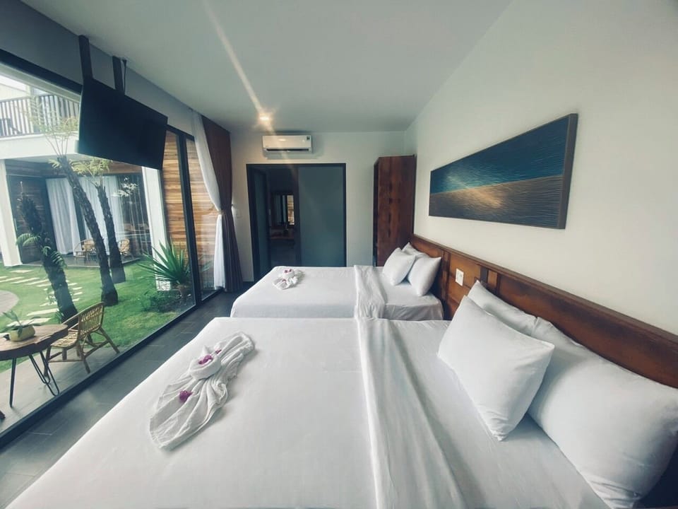 Family Quadruple Room, 2 Queen Beds, Pool View | Premium bedding, down comforters, memory foam beds, minibar