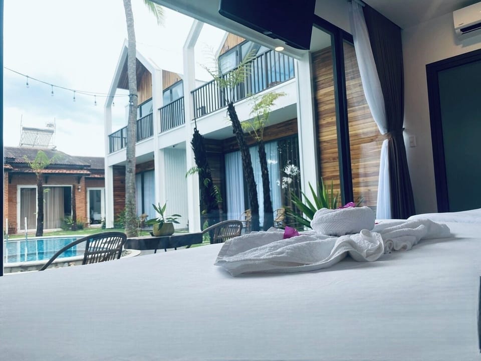 Family Quadruple Room, 2 Queen Beds, Pool View | Premium bedding, down comforters, memory foam beds, minibar