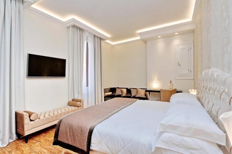 Deluxe Quadruple Room | In-room safe, desk, blackout drapes, soundproofing