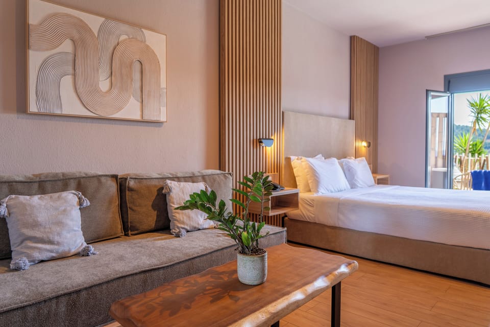 Deluxe Double or Twin Room, Jetted Tub, Partial Sea View | In-room safe, blackout drapes, soundproofing