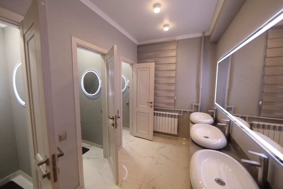Rainfall showerhead, designer toiletries, hair dryer, slippers